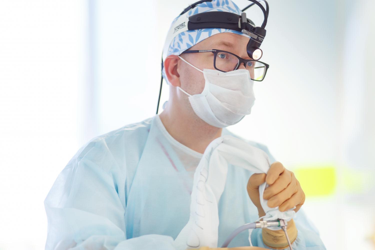 Thai Kid Boy With Glasses In Doctor Gown Or Uniform With Mask Like Surgeon  Or Dentist On Isolated Background Stock Photo, Picture and Royalty Free  Image. Image 99419189.